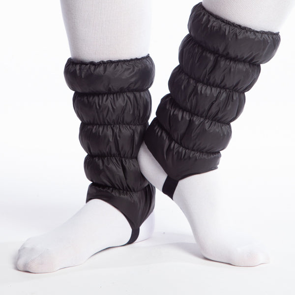 Hikas Gaiter in Black Onyx front view Feet are turned out slightly and left heel is raised approximately two inches and nearly touching right ankle. 