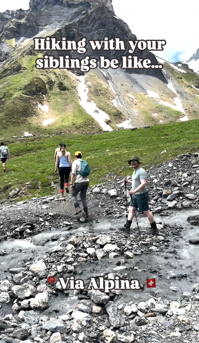 Video preview of Hiking with your siblings on the Via Alpina in Switzerland. A group of people crossing a creek while hiking in the Swiss Alps. Everyone in the group is wearing Hikas Gaiters. 